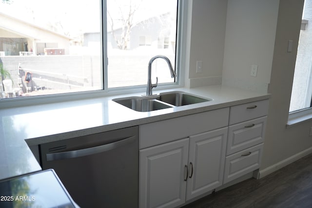 1632 E Saint Charles Ave, Phoenix, AZ 85042 - kitchen with dishwashing machine, white cabinetry, dark wood-style flooring, and light countertops