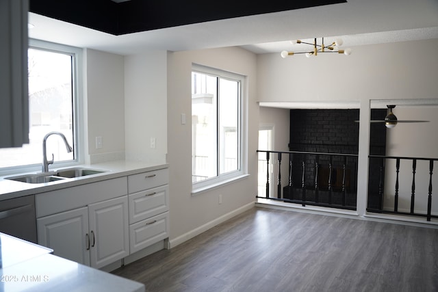 1632 E Saint Charles Ave, Phoenix, AZ 85042 - kitchen with a chandelier, wood finished floors, healthy amount of natural light, and a ceiling fan