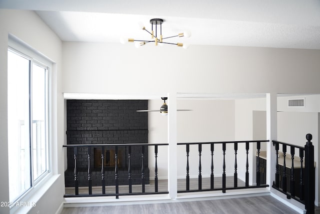 1632 E Saint Charles Ave, Phoenix, AZ 85042 - additional living space with wood finished floors, healthy amount of natural light, and a chandelier