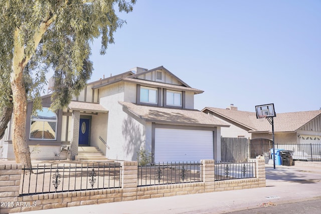 1632 E Saint Charles Ave, Phoenix, AZ 85042 - view of front of house with a fenced front yard, driveway, stucco siding, and a garage