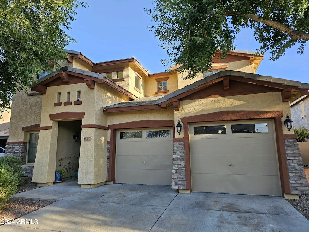 view of front of home with a garage