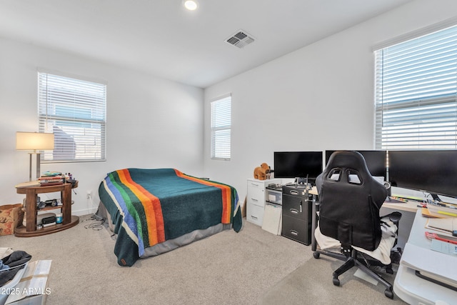 bedroom with carpet flooring and visible vents