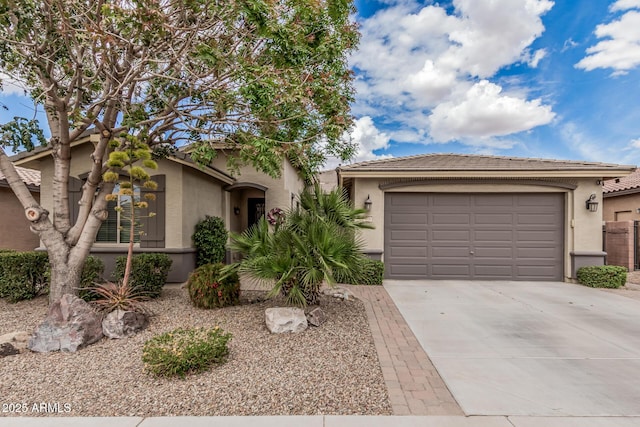 1078 W Redwood Ave, Queen Creek, AZ 85140 - view of front facade featuring driveway, stucco siding, an attached garage, and a tiled roof
