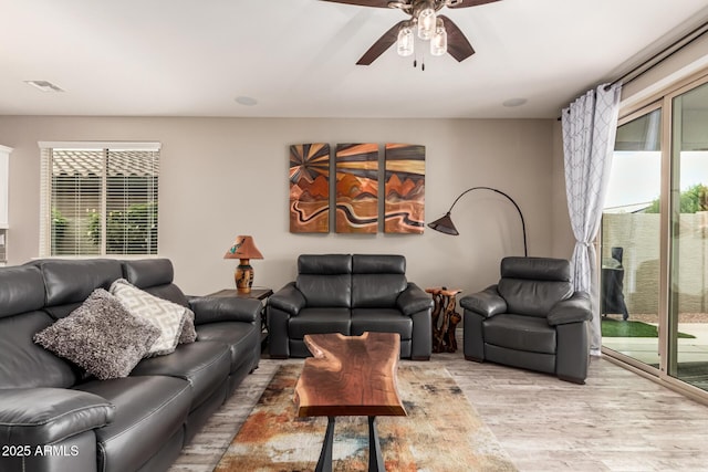 1078 W Redwood Ave, Queen Creek, AZ 85140 - living room featuring visible vents, a wealth of natural light, light wood-style flooring, and a ceiling fan