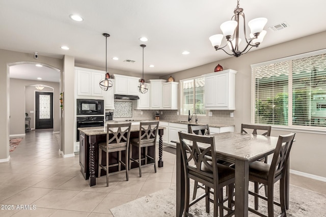1078 W Redwood Ave, Queen Creek, AZ 85140 - dining space featuring baseboards, visible vents, a chandelier, and light tile patterned floors