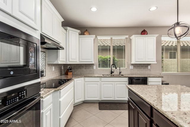 1078 W Redwood Ave, Queen Creek, AZ 85140 - kitchen with a sink, under cabinet range hood, white cabinetry, and black appliances
