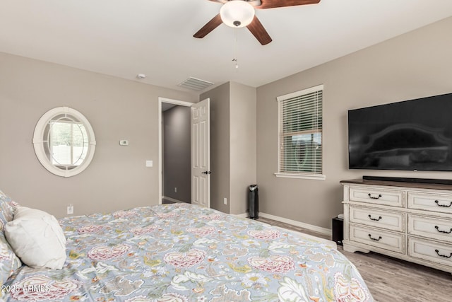 1078 W Redwood Ave, Queen Creek, AZ 85140 - bedroom with baseboards, ceiling fan, visible vents, and light wood finished floors
