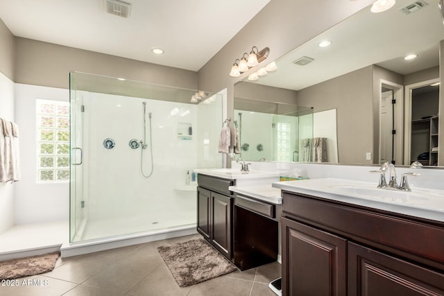 1078 W Redwood Ave, Queen Creek, AZ 85140 - bathroom featuring a shower stall, visible vents, tile patterned flooring, and a sink