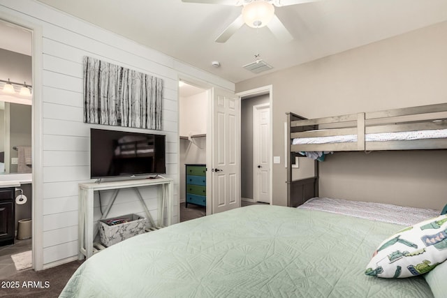 1078 W Redwood Ave, Queen Creek, AZ 85140 - bedroom featuring ensuite bathroom, visible vents, a walk in closet, and a ceiling fan