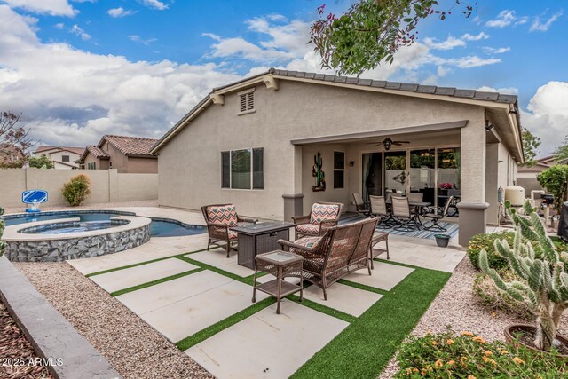 1078 W Redwood Ave, Queen Creek, AZ 85140 - rear view of house featuring a fenced backyard, a ceiling fan, outdoor lounge area, stucco siding, and a patio area