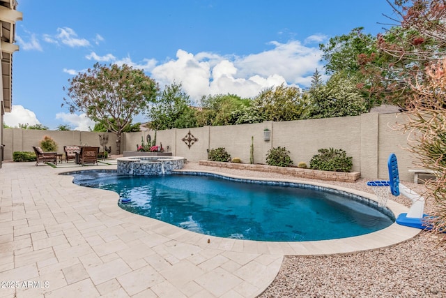1078 W Redwood Ave, Queen Creek, AZ 85140 - view of swimming pool featuring a fenced backyard, a pool with connected hot tub, and a patio