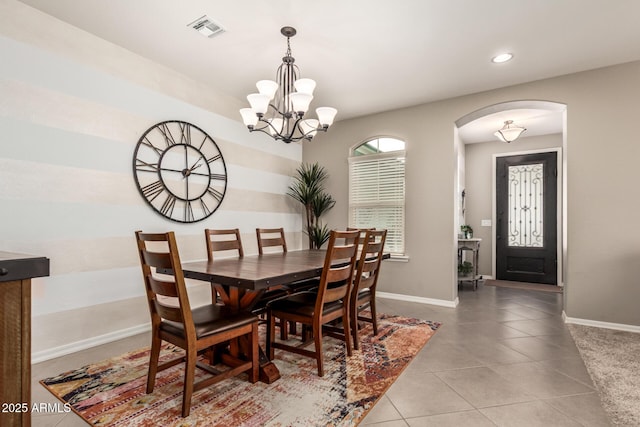 1078 W Redwood Ave, Queen Creek, AZ 85140 - dining room featuring arched walkways, baseboards, visible vents, and an inviting chandelier