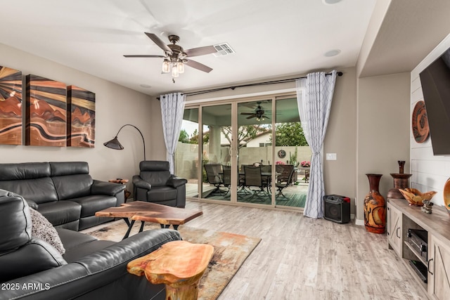 1078 W Redwood Ave, Queen Creek, AZ 85140 - living room featuring light wood finished floors, ceiling fan, and visible vents