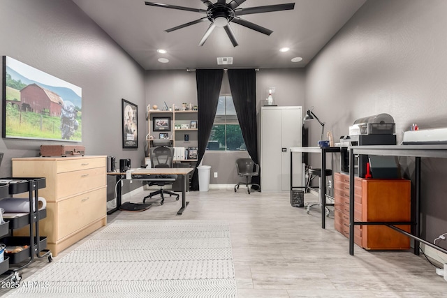 office space with ceiling fan, recessed lighting, baseboards, and light wood-type flooring