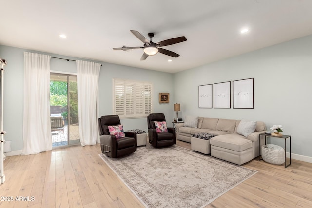 living area featuring ceiling fan, hardwood / wood-style floors, recessed lighting, and baseboards