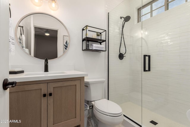 full bath featuring a shower stall, toilet, and vanity