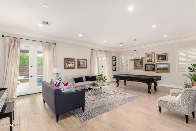 living room featuring french doors, billiards table, light wood-style flooring, ornamental molding, and recessed lighting