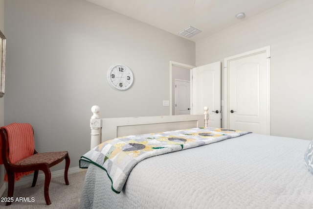 carpeted bedroom featuring baseboards