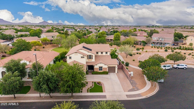 aerial perspective of suburban area with a mountain backdrop