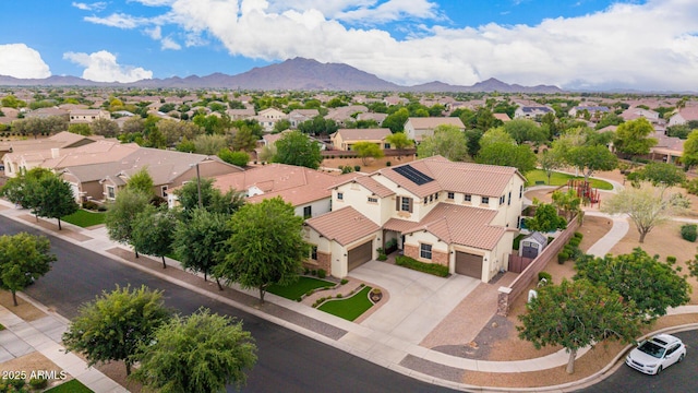 aerial view of residential area featuring a mountainous background