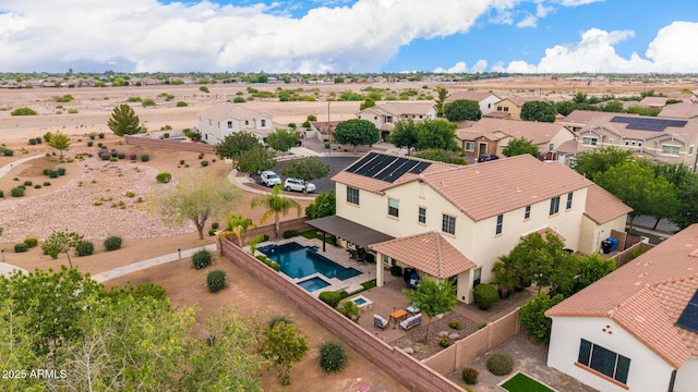 aerial perspective of suburban area featuring a pool area