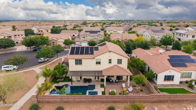 aerial perspective of suburban area featuring a pool