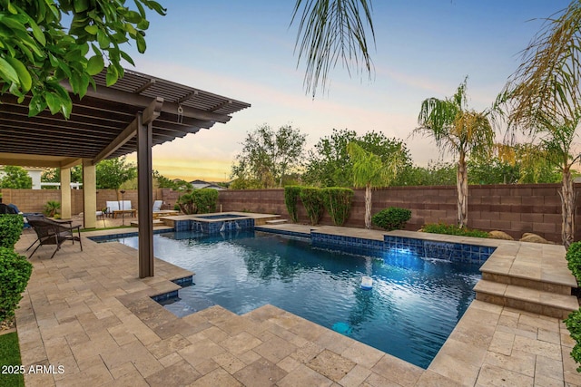 view of swimming pool featuring a fenced backyard, a patio area, and a pool with connected hot tub