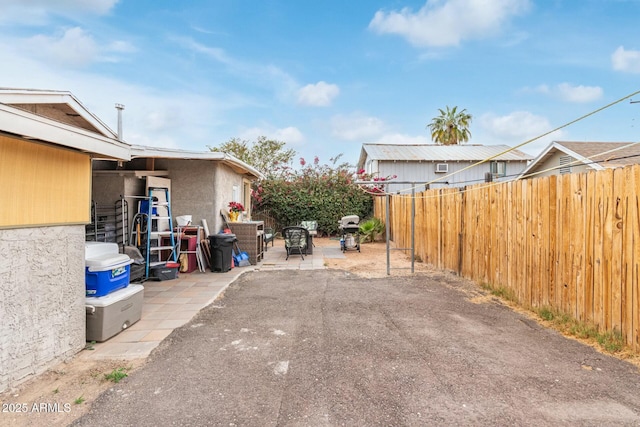 exterior space featuring fence and area for grilling