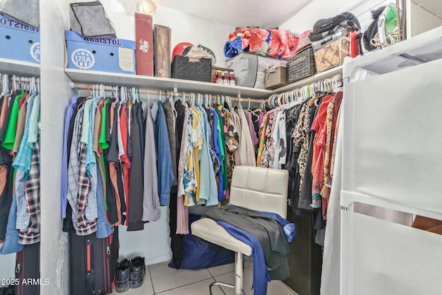 spacious closet featuring tile patterned floors