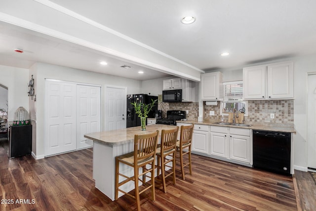2419 E Billings St, Mesa, AZ 85213 - kitchen with black appliances, a sink, dark wood finished floors, light countertops, and recessed lighting