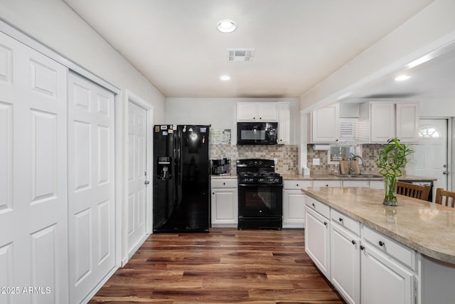 2419 E Billings St, Mesa, AZ 85213 - kitchen with black appliances, a sink, white cabinetry, dark wood-type flooring, and recessed lighting