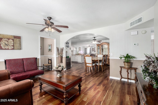 2419 E Billings St, Mesa, AZ 85213 - living area featuring a ceiling fan, arched walkways, and dark wood finished floors