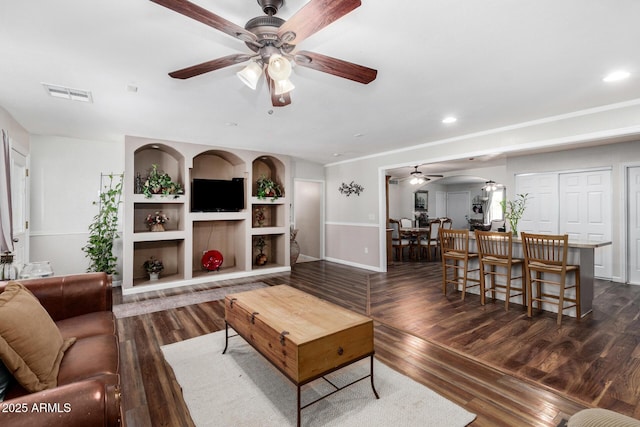 2419 E Billings St, Mesa, AZ 85213 - living room featuring a ceiling fan, arched walkways, dark wood-style flooring, baseboards, and recessed lighting