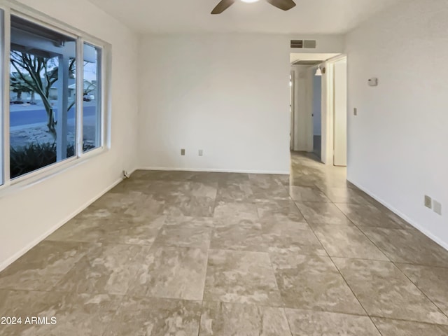 spare room with ceiling fan