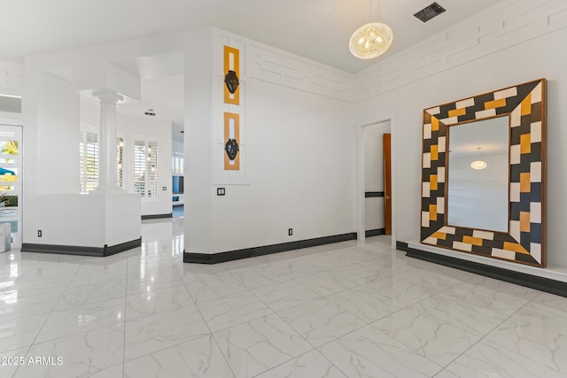 10417 N 180th Dr, Waddell, AZ 85355 - spare room with marble finish floor, decorative columns, visible vents, and baseboards