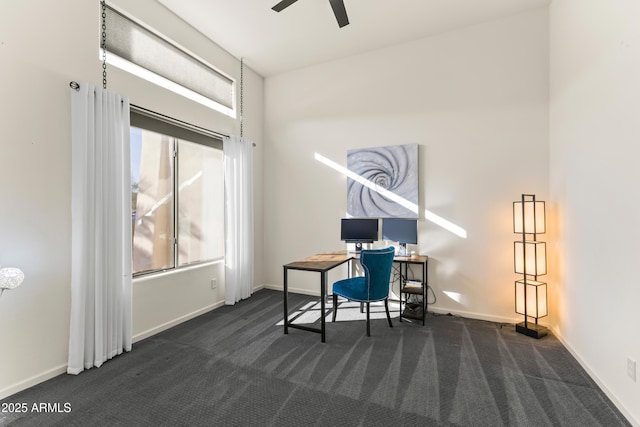 10417 N 180th Dr, Waddell, AZ 85355 - home office featuring dark colored carpet, ceiling fan, and baseboards