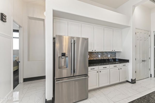 10417 N 180th Dr, Waddell, AZ 85355 - kitchen with high end fridge, marble finish floor, and white cabinetry