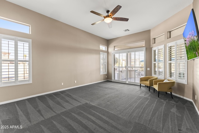 10417 N 180th Dr, Waddell, AZ 85355 - unfurnished room with baseboards, visible vents, dark colored carpet, and a ceiling fan