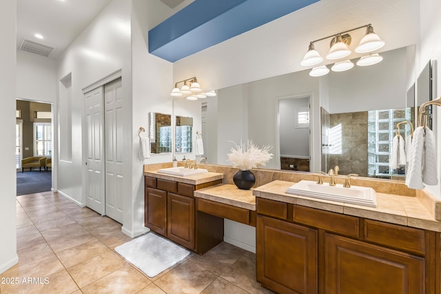 10417 N 180th Dr, Waddell, AZ 85355 - full bath featuring tile patterned floors, a closet, visible vents, and walk in shower