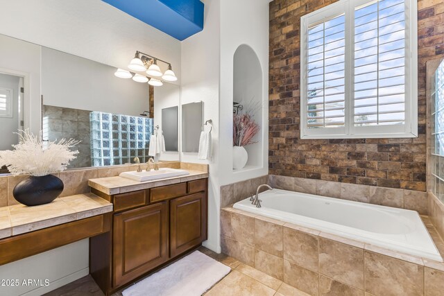 10417 N 180th Dr, Waddell, AZ 85355 - bathroom featuring a garden tub, tile patterned flooring, and vanity