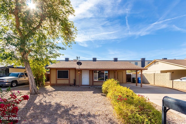 single story home featuring a carport