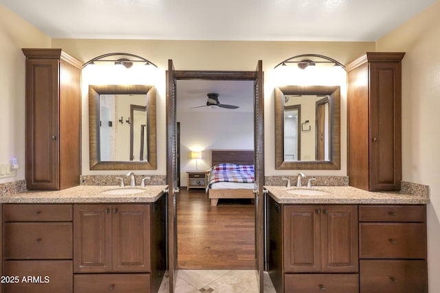 bathroom with ceiling fan, vanity, and tile patterned floors