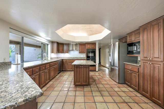 kitchen featuring a center island, black appliances, wall chimney exhaust hood, light tile patterned flooring, and light stone counters