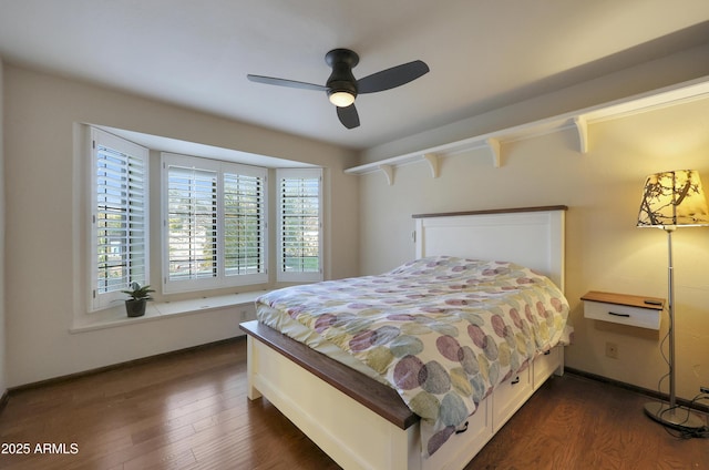 bedroom with ceiling fan and dark wood-type flooring