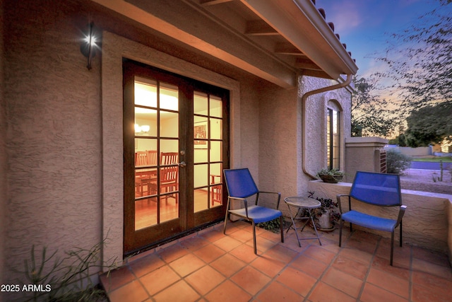 patio terrace at dusk with french doors