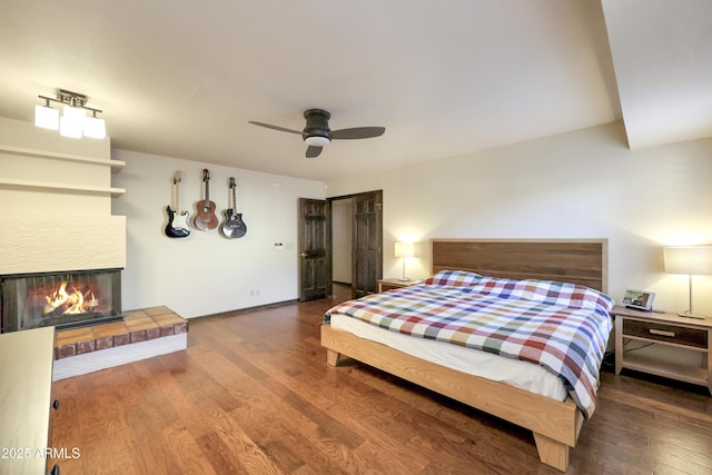 bedroom featuring ceiling fan and hardwood / wood-style flooring