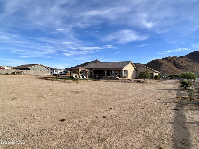 rear view of house with a mountain view