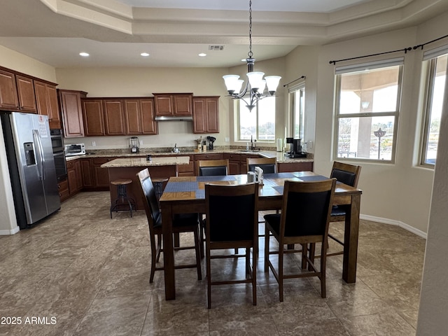 dining area featuring a toaster, baseboards, visible vents, a chandelier, and recessed lighting