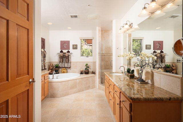 bathroom with a stall shower, visible vents, a garden tub, and tile patterned floors