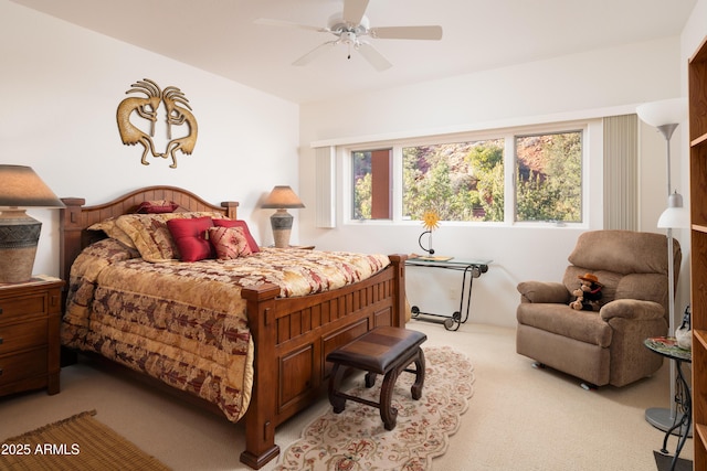 bedroom featuring a ceiling fan and light colored carpet